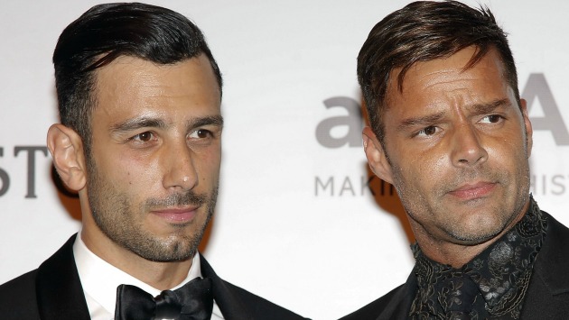 Singer Ricky Martin, right, and artist Jwan Yosef pose on the red carpet of The Foundation for AIDS Research (amfAR) event in Sao Paulo, Brazil, Friday, April 15, 2016. (AP Photo/Andre Penner)