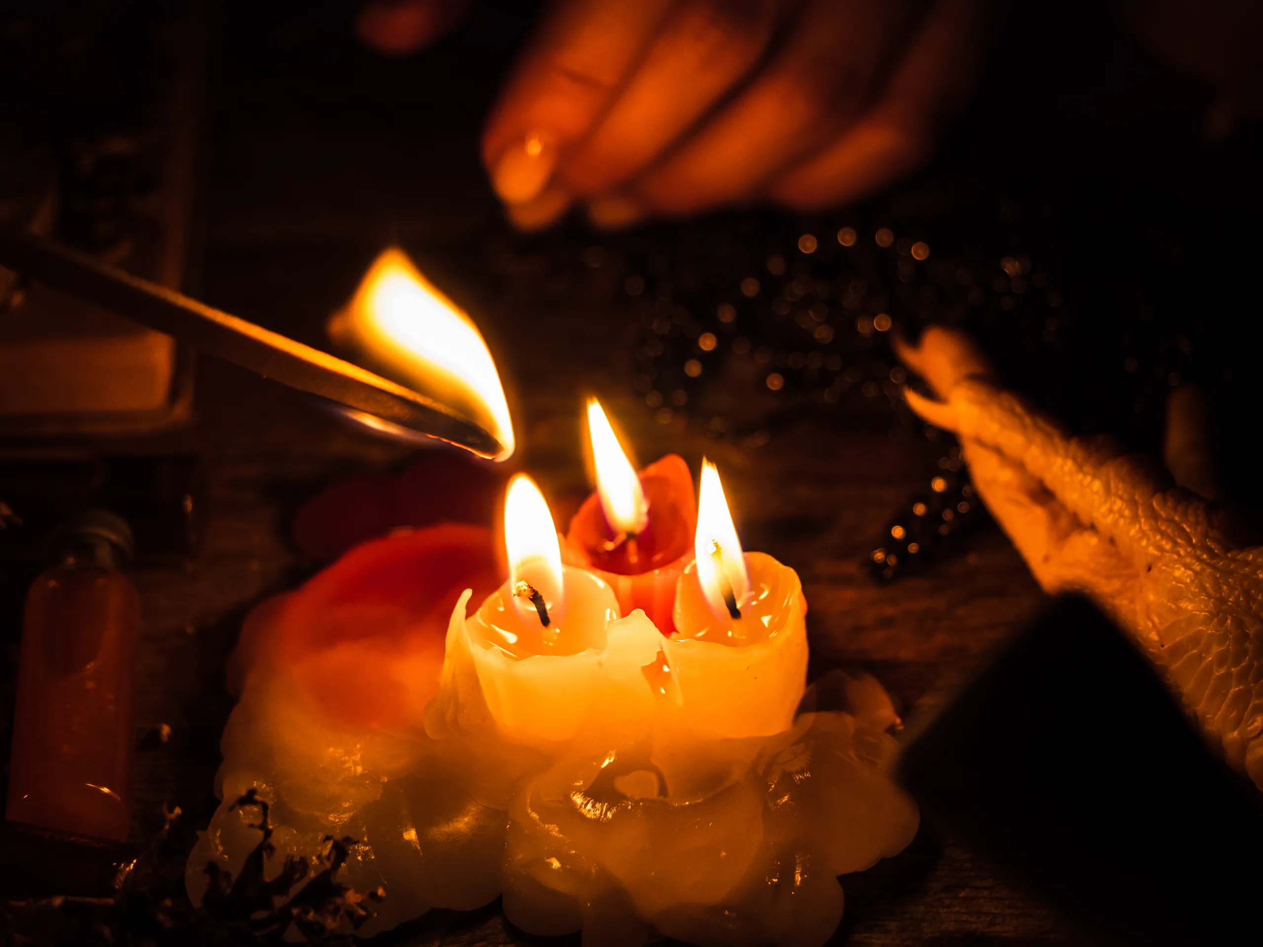 A Witch Lights A Wand From A Candle For Magical Rituals. Attributes Of Occultism And Magic