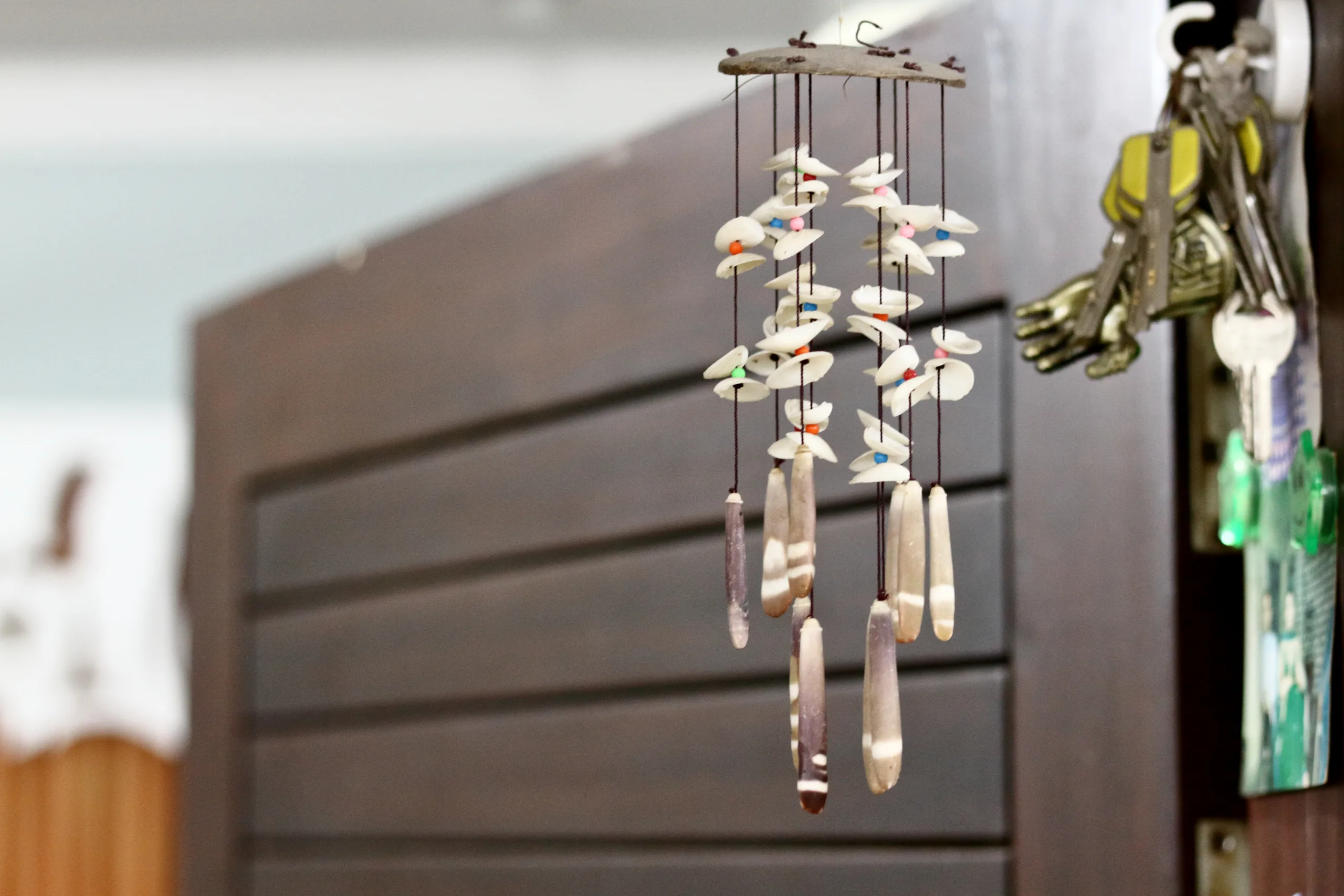 Hanging Wind Chimes By The Door In Living Room.